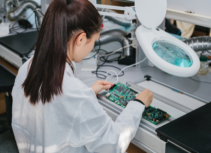 women working on a circuit
