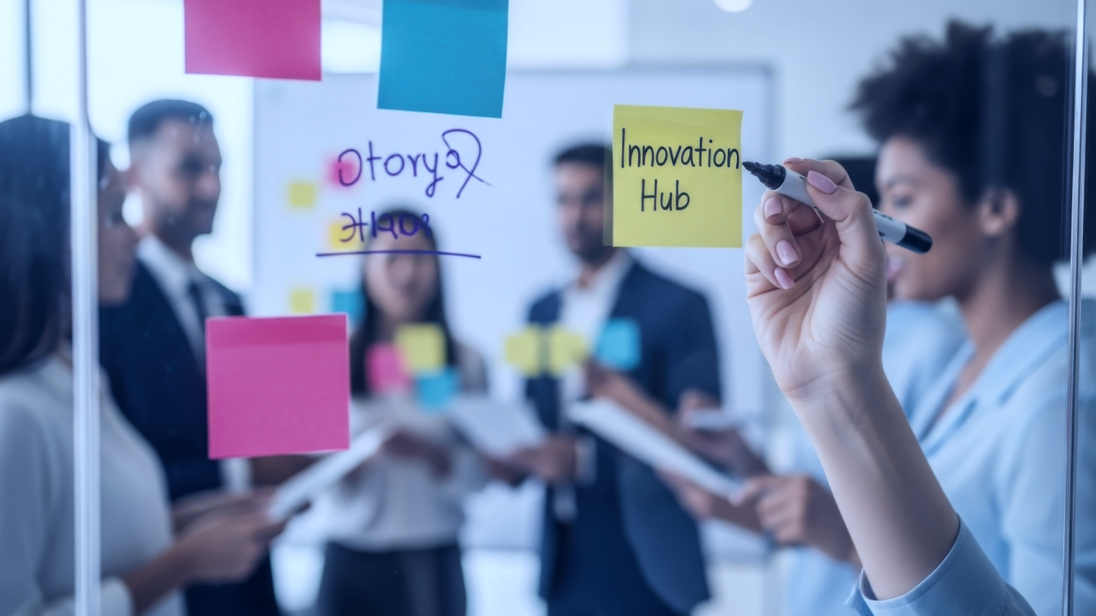 People gather in an office and write on Post-its.